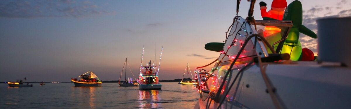 holiday lights on boats in water