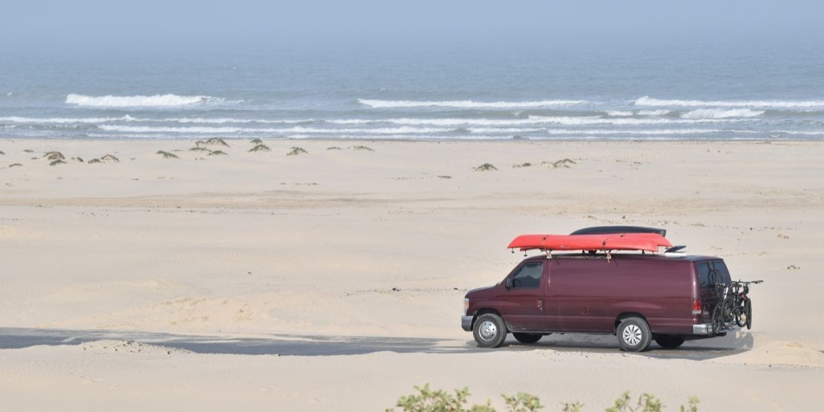 red van driving on South padre island beach